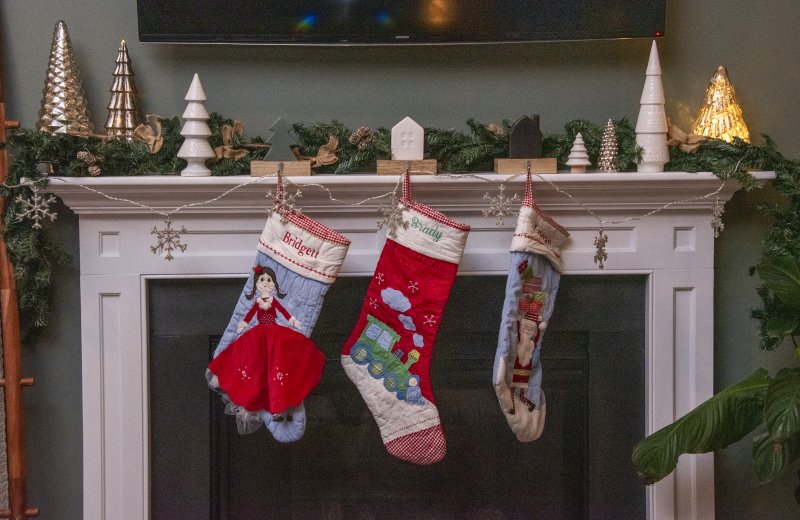 Kelly and Chris Cole have their stockings hung by the chimney with flair at their West Shore Drive home.